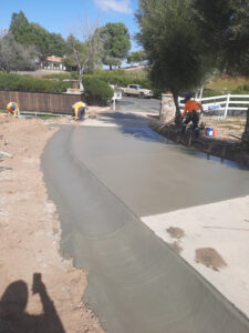 Radius brow ditch that goes along the driveway to preven the concrete from washing out